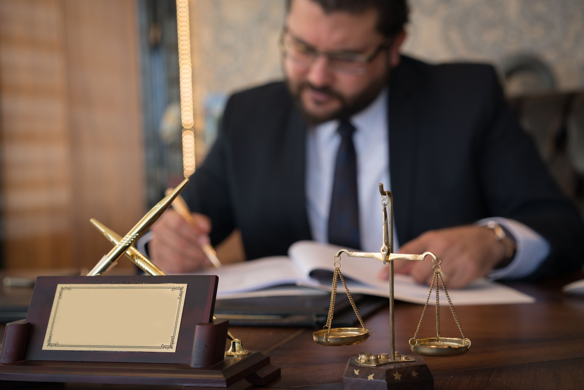 Caucasian lawyer signing documents  in office